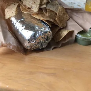 Super burrito, barbacoa, green salsa. Complementary chips( only with the burrito)