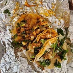 Highly recommended the al pastor tacos.