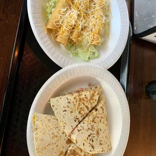 two plates of food on a tray