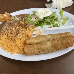 Shredded chicken flautas with a ácida sour cream rice and beans. Perfect.