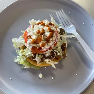 a taco on a plate with a fork
