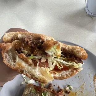 Torta de chorizo &amp; red salsa (background pastor quesadilla)