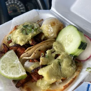 Al pastor tacos w/ cream green salsa; crispy.