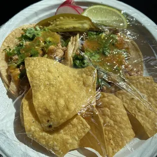 two chicken/pollo tacos