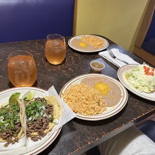 asada tacos, rice and beans, chicken tostada and (2) Bahama Mama drinks!