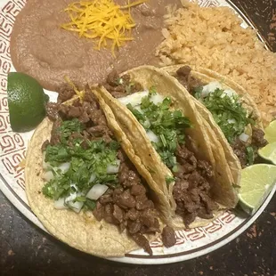 asada (steak) taco dinner. Includes 3 tacos with a side of rice and beans. Delicious!