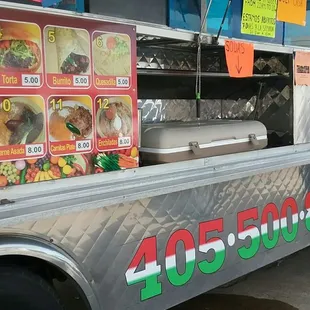 a taco truck parked in a parking lot