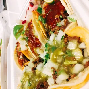 Green=mild, red=hot. Get both of you can handle it. Amazing flavor