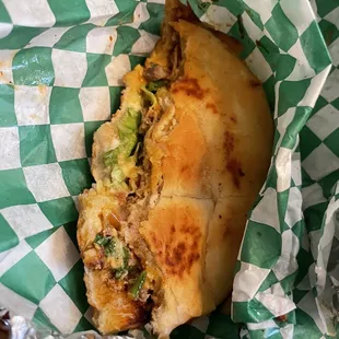 Torta with carnitas, créma, mayo, lettuce, tomato, hot sauce and jalapeño. Delish!