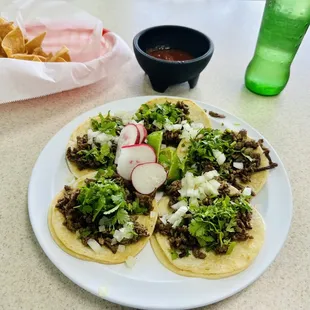 a plate of tacos and chips