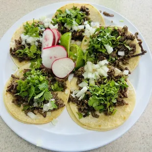 a plate of tacos on a table