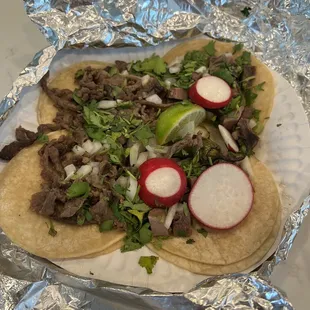 Two lengua and two Asada tacos