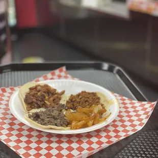 a plate of tacos on a tray