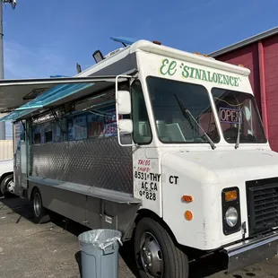 a taco truck parked in a parking lot