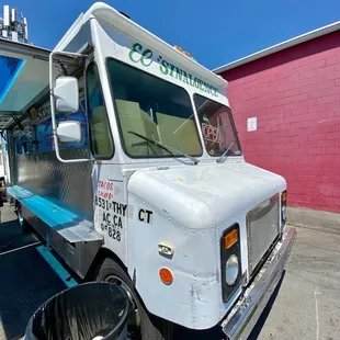 a taco truck parked in a parking lot