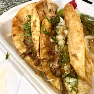 Tacos de Barbacoa on point!! Crispy tortilla with a delicious meat. Dip then in their birria for even more flavor!
