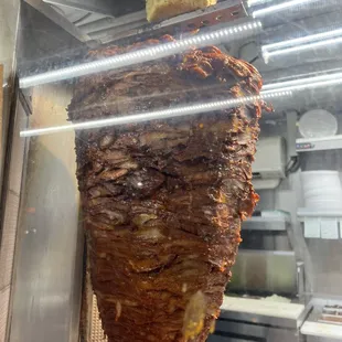 a meat hanging from a rack