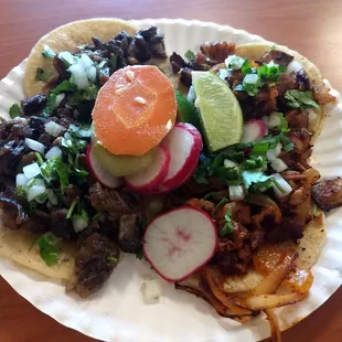 Tacos de Cabeza and Al Pastor. Delicious, but you gotta pound em quick, before the paper plate falls apart:)