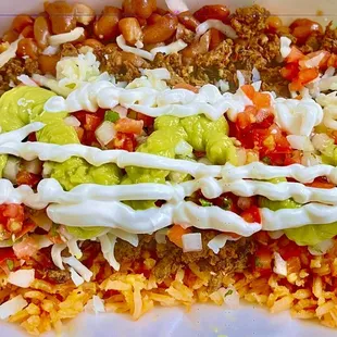 a taco and rice dish in a styrofoam container