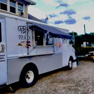 a food truck parked in front of a house