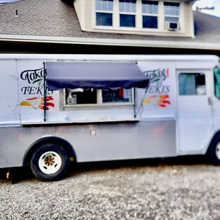 a food truck parked in front of a house