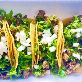 three tacoss in a styrofoam container