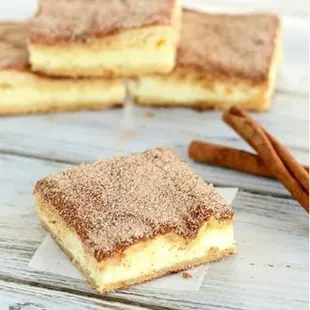 a close up of a piece of cheesecake bars