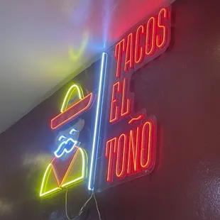 a neon sign for a mexican restaurant