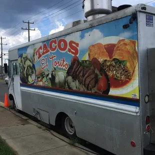 a taco truck parked on the side of the road