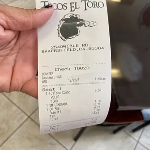 a person holding a receipt