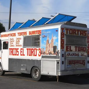 a taco truck parked in a parking lot