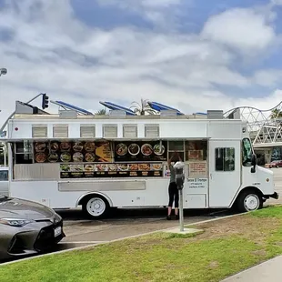 a taco truck parked on the side of the road