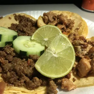 Carne Asada and Chicken Tacos. Make sure to get some cilantro and onion!