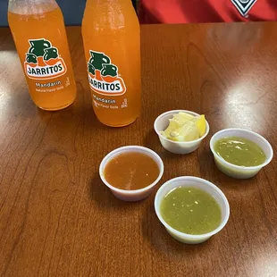 A couple of mandarin Juaritos and their salsas