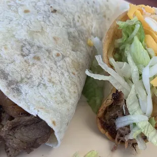Close-up of the Friday special soft taco and a single crispy shredded beef taco
