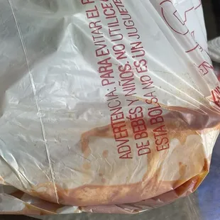 The food should be in the container not in the plastic carrying bag