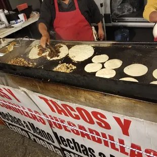 a man making tortillas