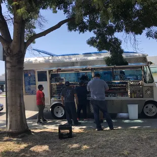 people ordering food from a food truck
