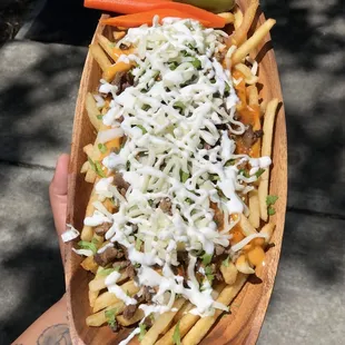 a person holding a plate of food