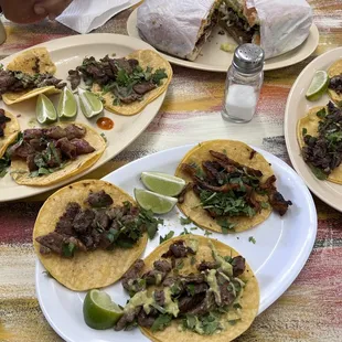 Bistek tacos, pastor tacos barbacoa taco and a torta