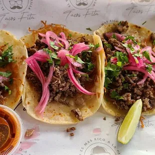 three tacos on a tray