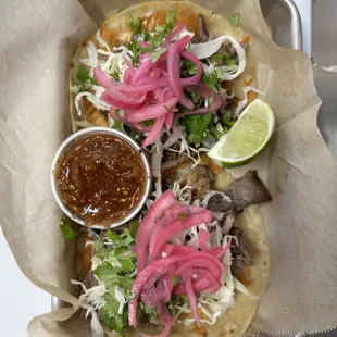 a taco with a side of salsa