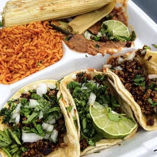 a plate of tacos and rice