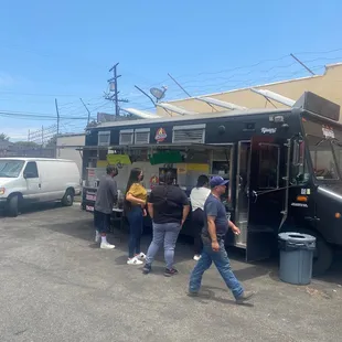 people getting food from a food truck