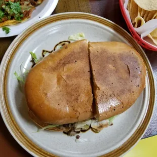 Torta de asada... very tasty.  Simple.  Slightly disappointed  that the picture showed avocado (my favorite) and no avocado was in my torta.