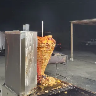 a large basket of food being cooked
