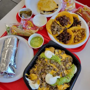 Super nachos con birria, super burrito, mulita con al pastor, y tacos (asada, AL pastor, pollo, y lengua)