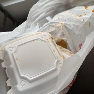 Wet burrito sauce at the bottom of the bag. Don&apos;t know how to bag their to-go orders properly.