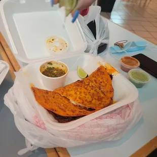a person putting a lime on a tortilla