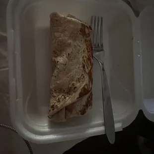 $16 burrito next to a regular sized fork